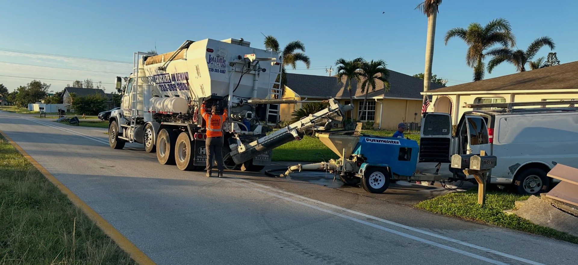 Concrete pump truck and mixer working a residential pour