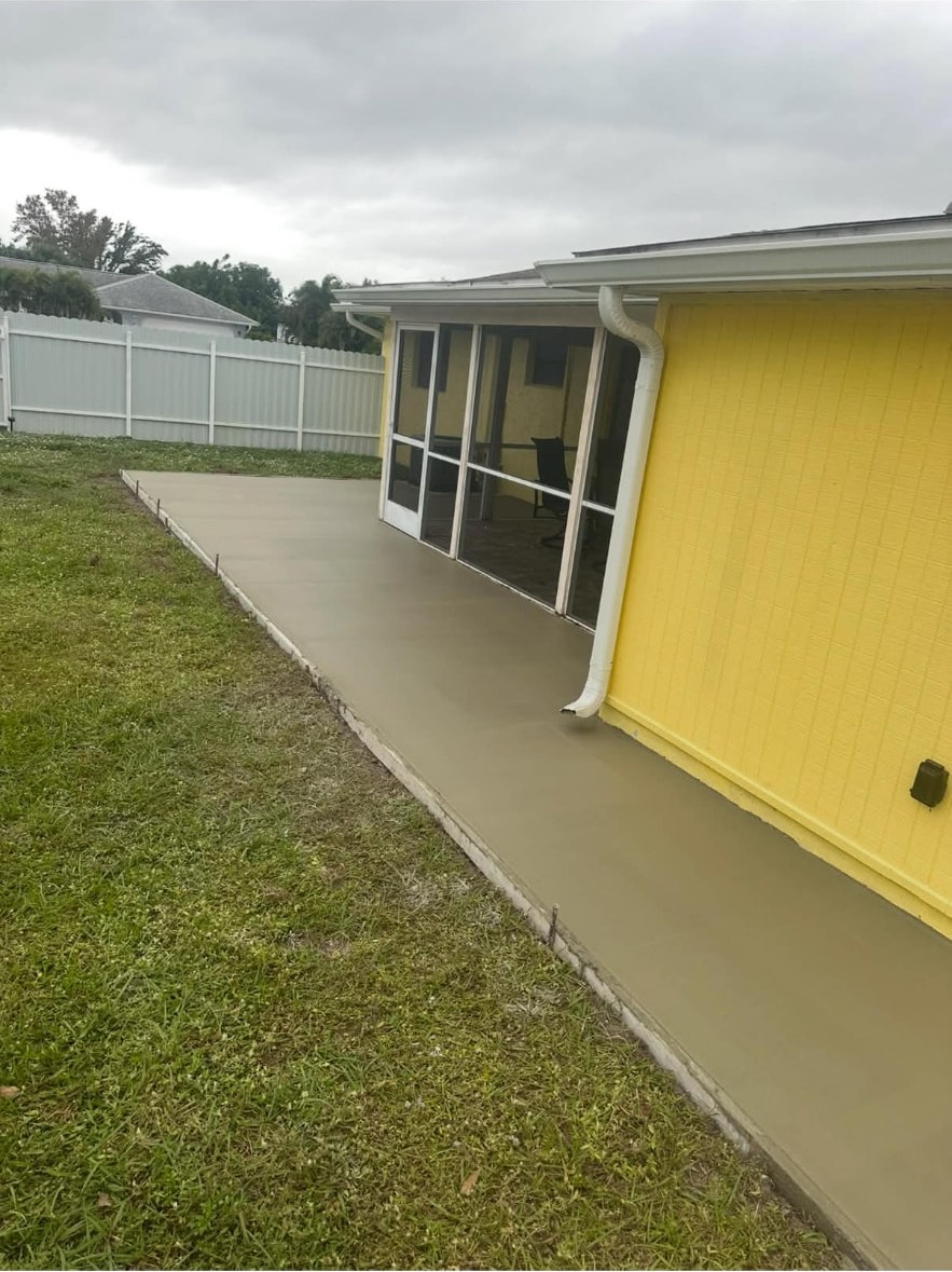 Wrap-around walkway poured along the side of a house