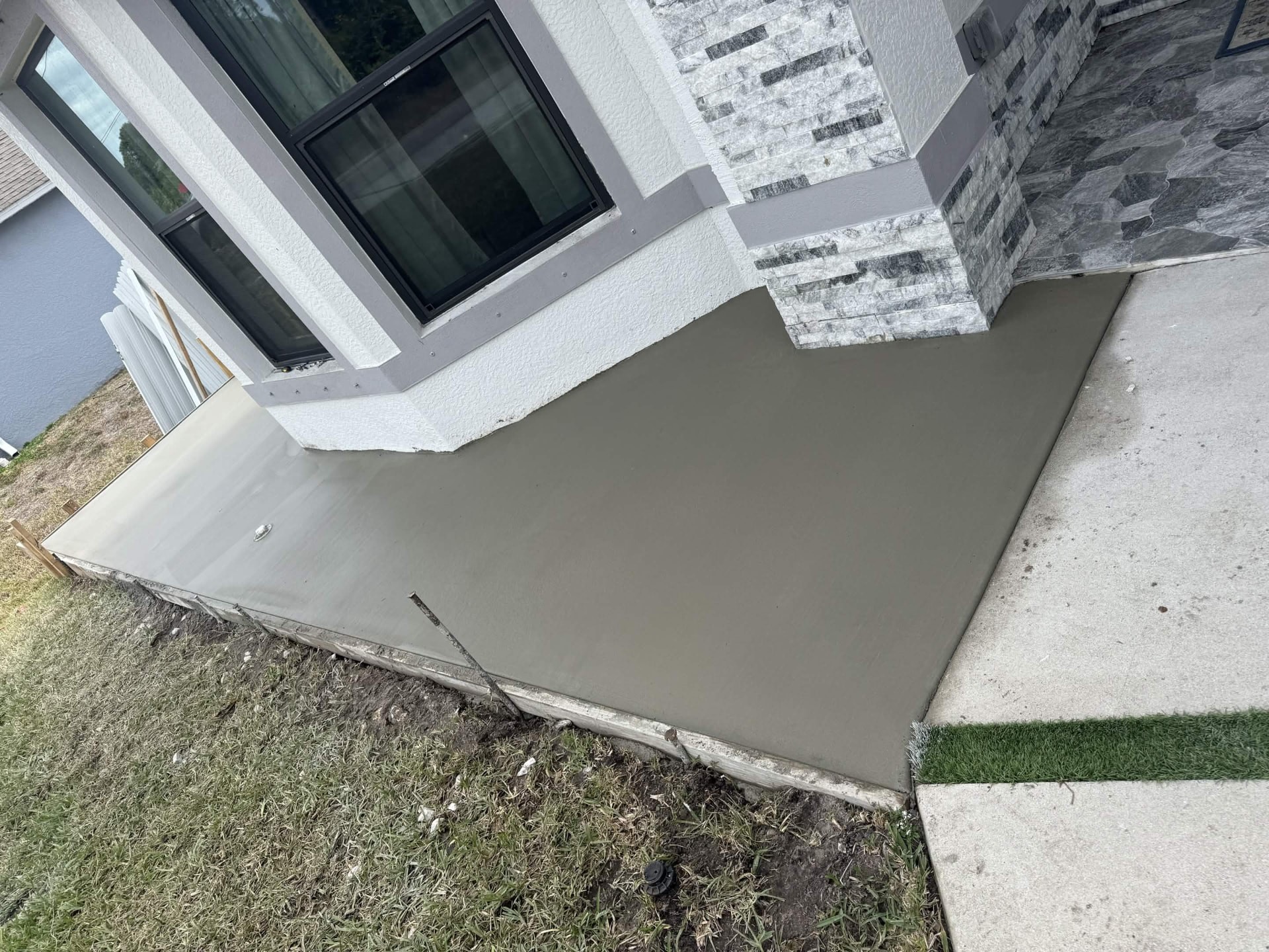Finished corner slab tied into the existing walkway